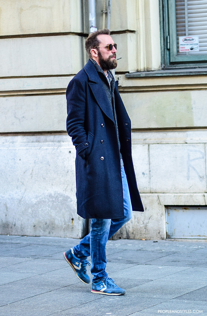 Casual Winter Outift: Men Wearing Overcoats #mensfashion #menswear by PeopleandStyles.com Guys casual winter fashion pinterest, what to wear with a wool coat, how to vear navy longer coat, cardigan and sneakers, how to wear light blue sneakers men, how to wear sneakers men pinterest