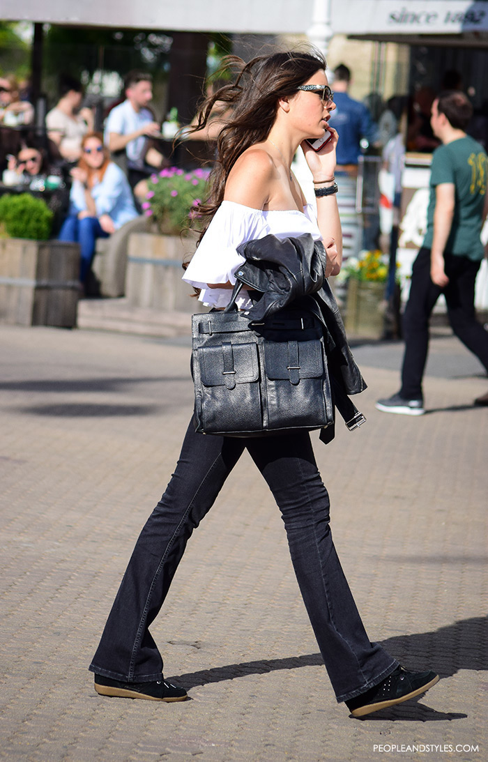 Street style summer women's fashion, how to wear off the shoulder white Zara top, wedge sneakers Isabel Marant and black flared jeans