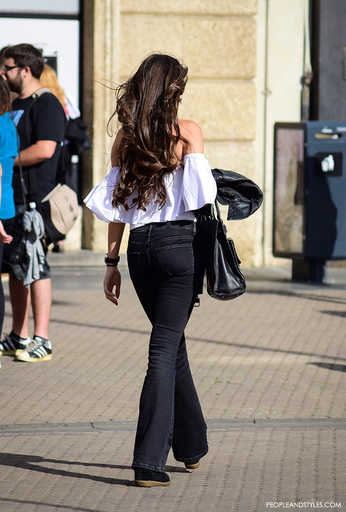 Street style summer women's fashion, how to wear off the shoulder white Zara top, wedge sneakers Isabel Marant and black flared jeans