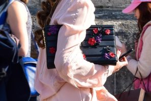 Street Look: Nergin Mirsalehi in a Pink Jumpsuit and Black Boots during Paris Fashion Week