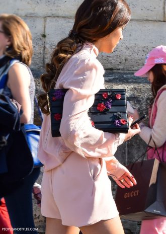 Street Look: Nergin Mirsalehi in a Pink Jumpsuit and Black Boots during Paris Fashion Week