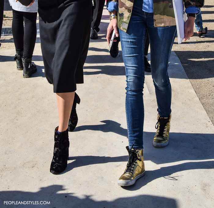 denim on denim as a base and worked her style mixing camo jacket and golden high-top sneakers, wear to work outfit inspiration from Paris fall street style